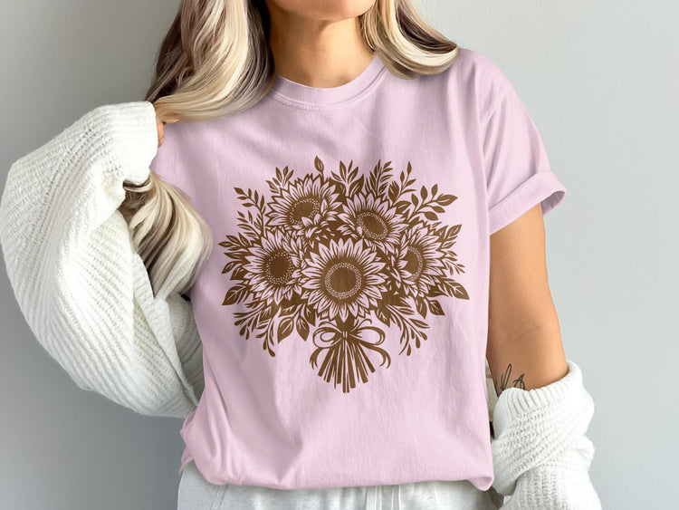 Pink t-shirt with a brown sunflower bouquet graphic and tied bow.