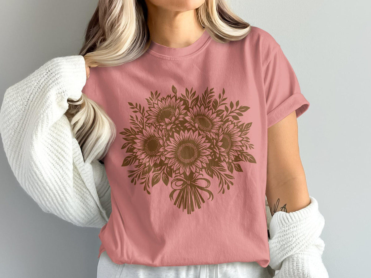 Pink t-shirt with a brown sunflower bouquet graphic and bow detail.