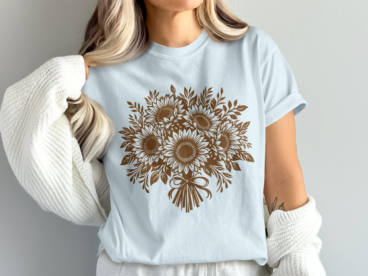 Light blue t-shirt with a brown sunflower bouquet design and bow.