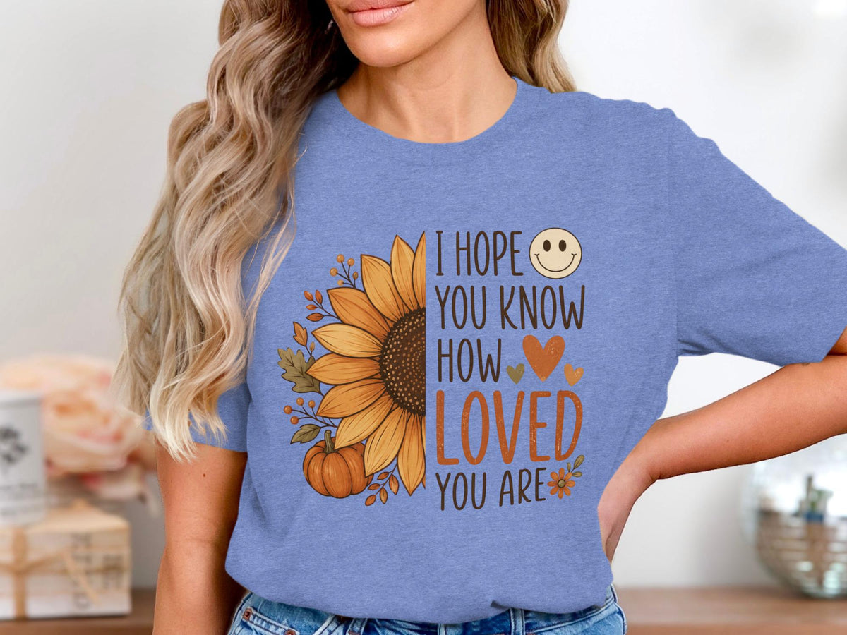Blue t-shirt with sunflower, pumpkin, leaves, and "I hope you know how loved you are" text.
