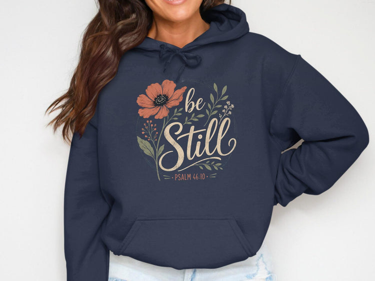 Navy hoodie with floral design and text "be Still Psalm 46:10".