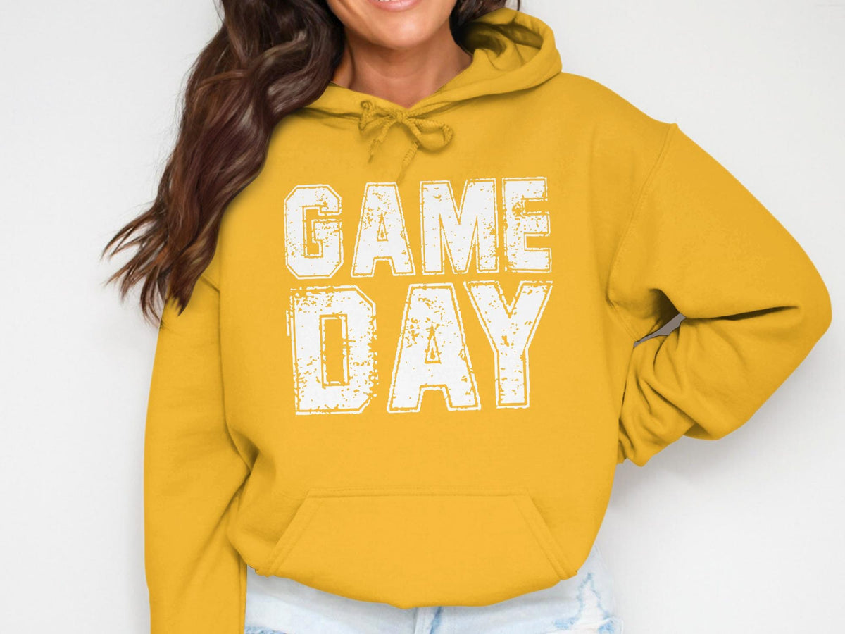 Yellow hoodie with distressed white text "GAME DAY" across the chest.