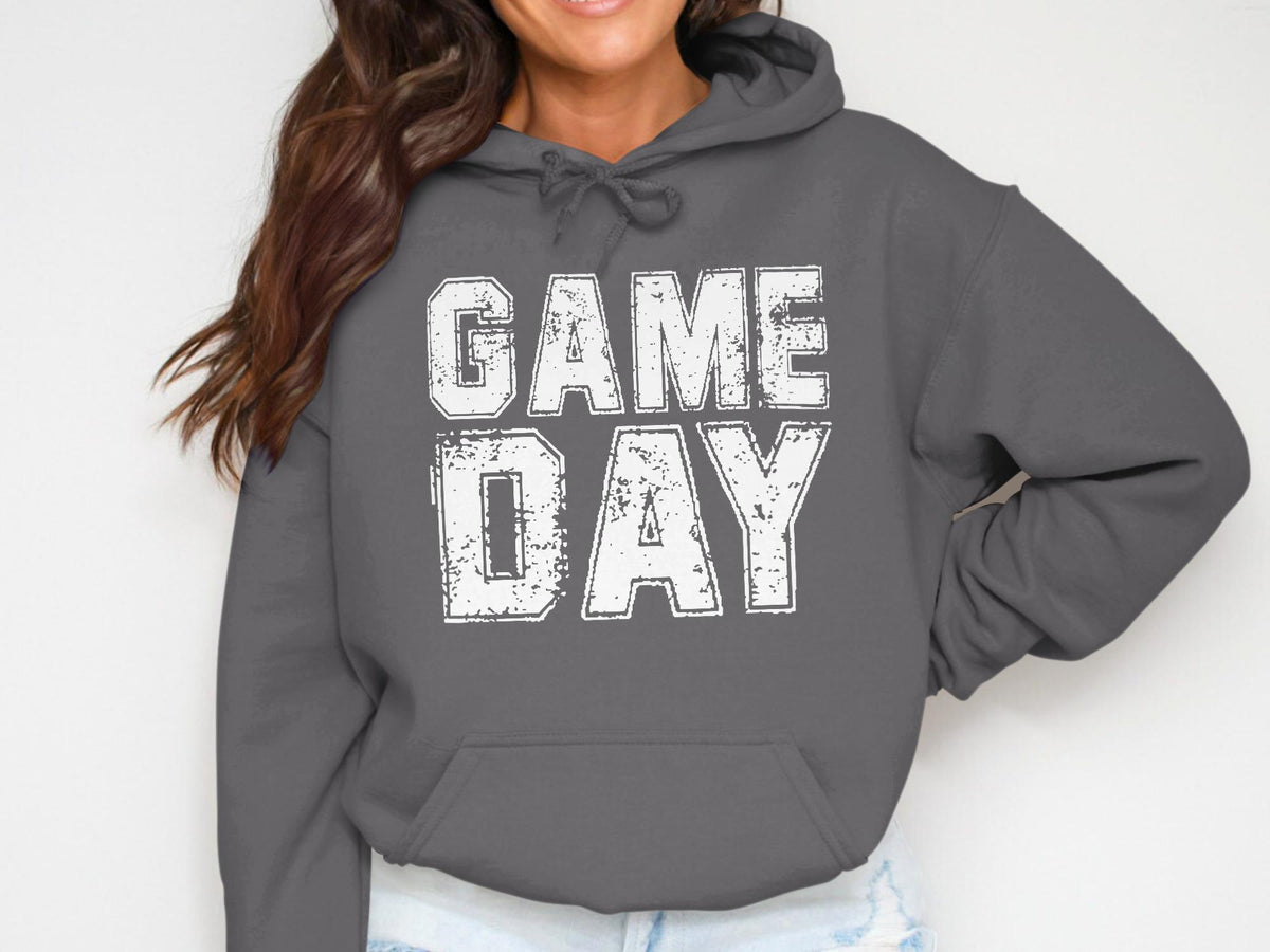 Dark grey hoodie with white distressed text "GAME DAY" across the chest.
