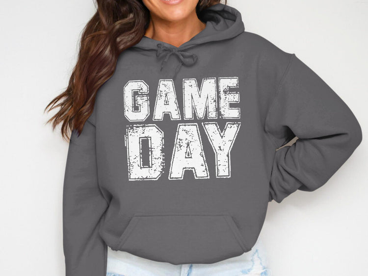 Dark grey hoodie with white distressed text "GAME DAY" across the chest.