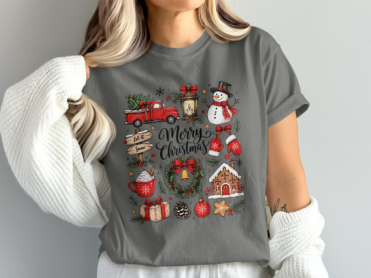 Gray t-shirt with a festive Christmas graphic featuring a truck, snowman, and gingerbread house.