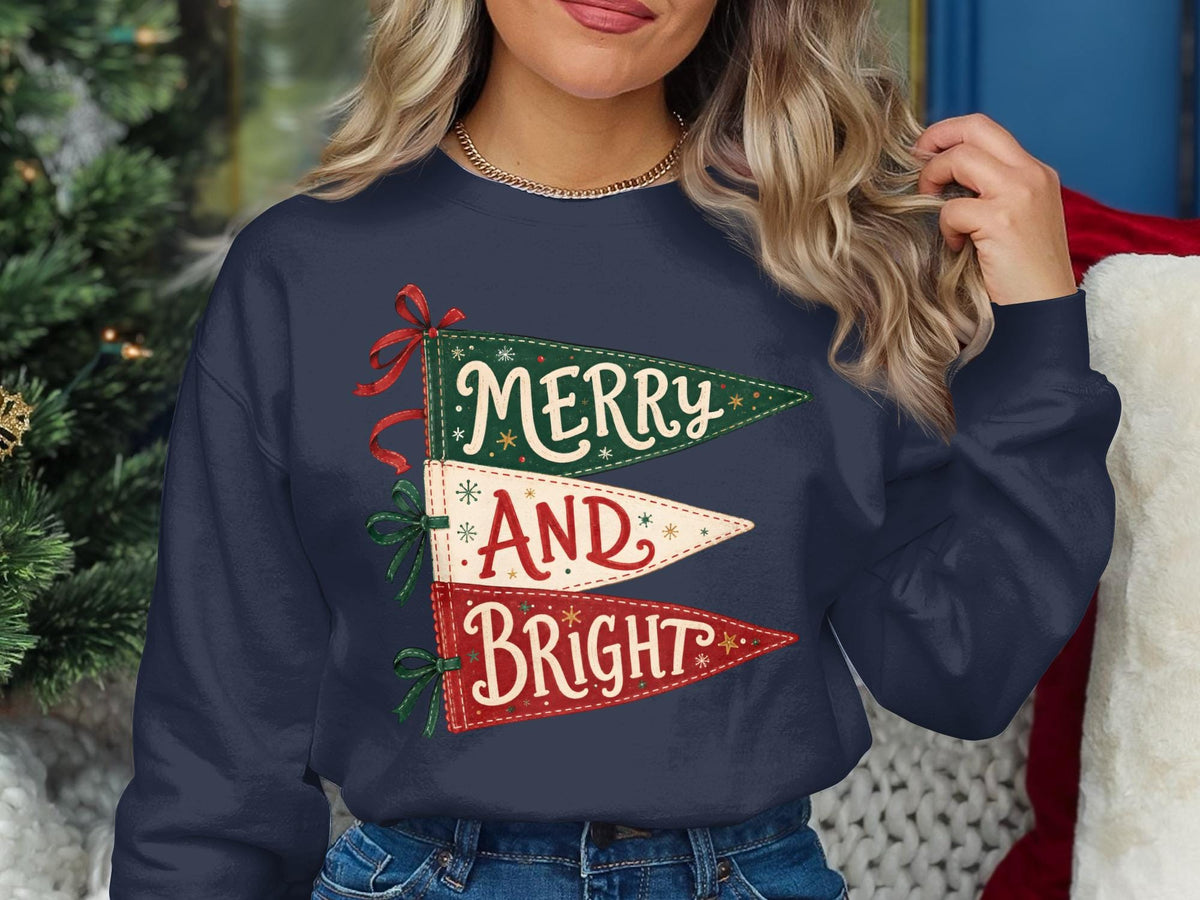 Navy sweatshirt with three pennant flags reading "Merry And Bright" in festive colors.