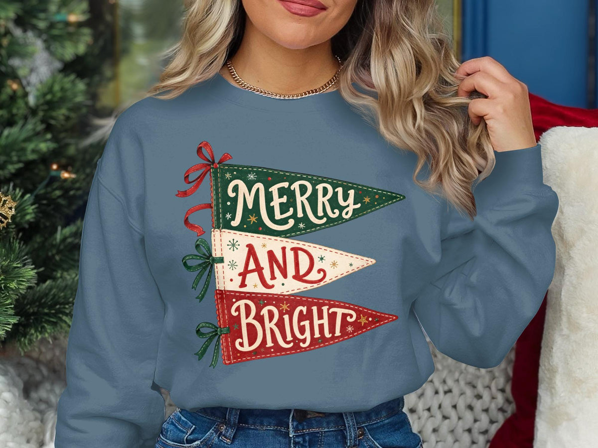Blue sweatshirt with stacked pennants reading "Merry," "And," and "Bright."